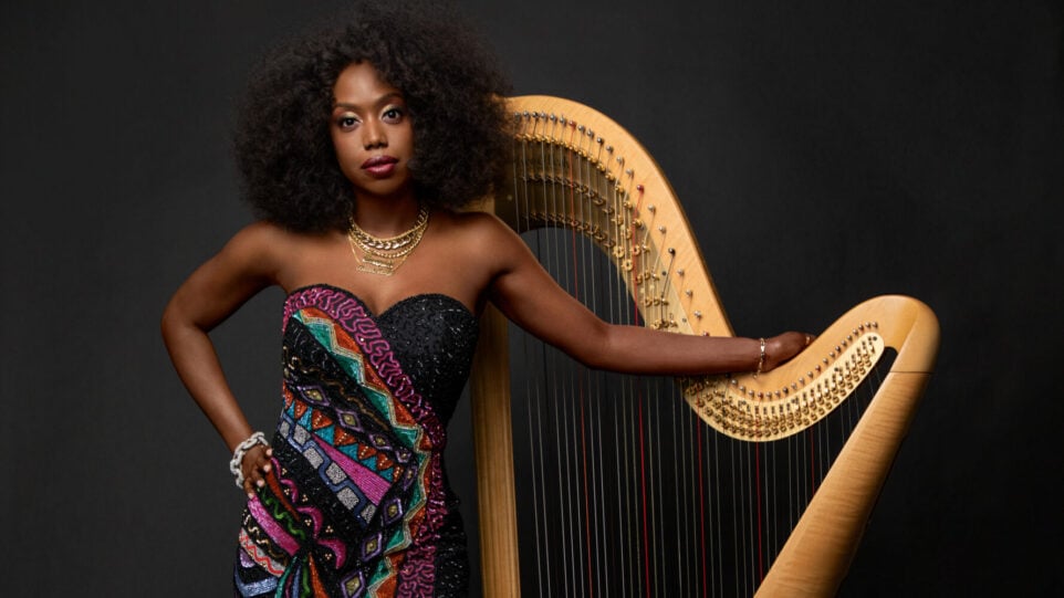 Brandee Younger poses with her harp