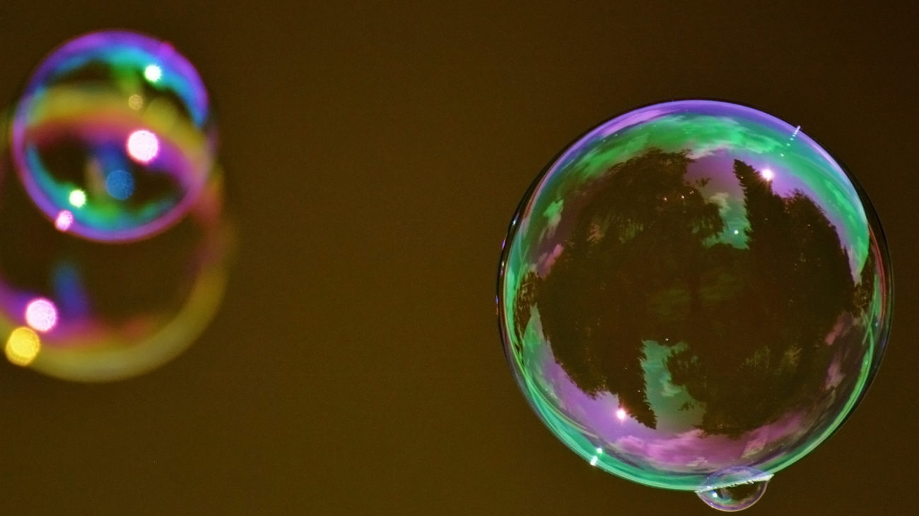 Watching This "Bubble Smith" Blow Big Bubbles to Bach on a Beach Is